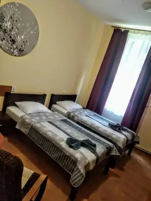 Łóżko lub łóżka w pokoju w obiekcie Hotel Sportowy