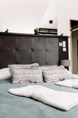 Łóżko lub łóżka w pokoju w obiekcie SkyLOFT & MiniLOFT Opole