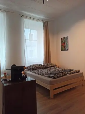 Łóżko lub łóżka w pokoju w obiekcie Śródmieście 3