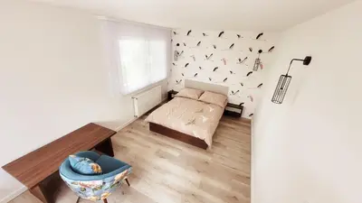 Łóżko lub łóżka w pokoju w obiekcie apartamenty nad jeziorem