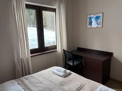 Łóżko lub łóżka w pokoju w obiekcie Janowa Góra 9A