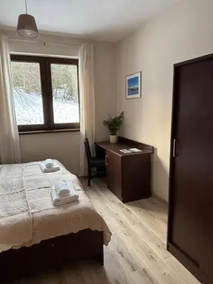 Łóżko lub łóżka w pokoju w obiekcie Janowa Góra 9A