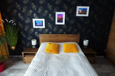 Łóżko lub łóżka w pokoju w obiekcie Słowik Apartament