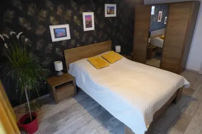 Łóżko lub łóżka w pokoju w obiekcie Słowik Apartament