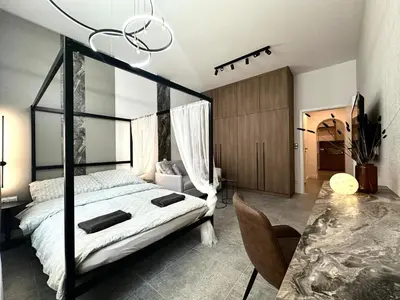 Łóżko lub łóżka w pokoju w obiekcie Dubois Apartment - Self Check-In 20h