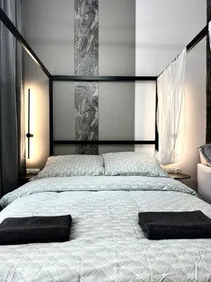 Łóżko lub łóżka w pokoju w obiekcie Dubois Apartment - Self Check-In 20h