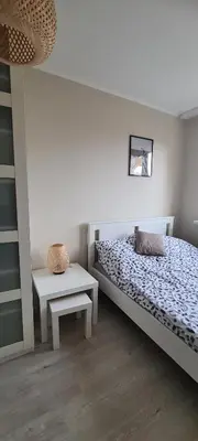Łóżko lub łóżka w pokoju w obiekcie Apartament Retro