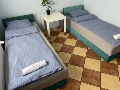Łóżko lub łóżka w pokoju w obiekcie Wiejska Chata w Doline Baryczy