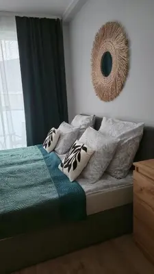 Łóżko lub łóżka w pokoju w obiekcie Apartament Gamma Zwycięska Wrocław