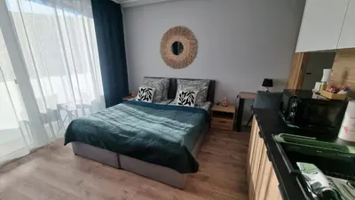 Łóżko lub łóżka w pokoju w obiekcie Apartament Gamma Zwycięska Wrocław