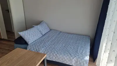 Łóżko lub łóżka w pokoju w obiekcie Apartament Gamma Zwycięska Wrocław