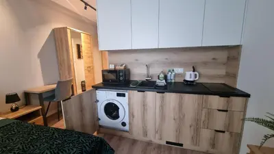 Kuchnia lub aneks kuchenny w obiekcie Apartament Gamma Zwycięska Wrocław