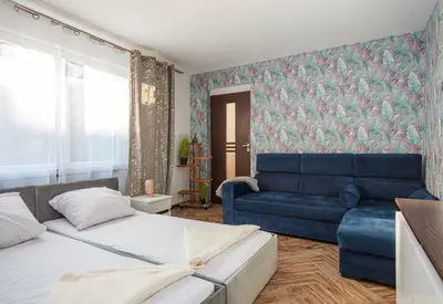 Łóżko lub łóżka w pokoju w obiekcie Plac Uniwersytecki 15B