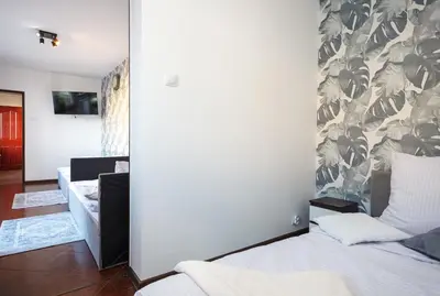 Łóżko lub łóżka w pokoju w obiekcie Plac Uniwersytecki 15B