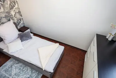 Łóżko lub łóżka w pokoju w obiekcie Plac Uniwersytecki 15B