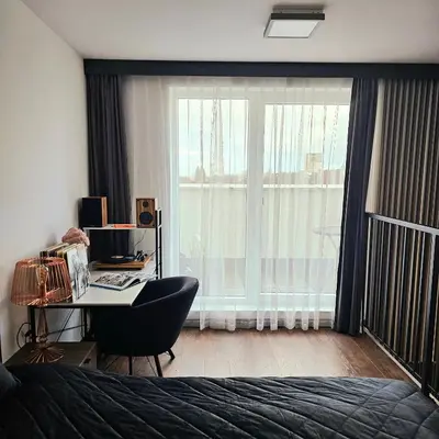 Łóżko lub łóżka w pokoju w obiekcie Apartament Wrocław Promenady