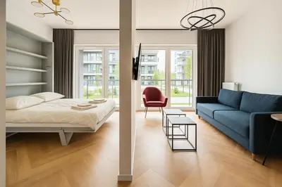 Łóżko lub łóżka w pokoju w obiekcie Apartament Kępa Mieszczńska Wrocław