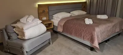 Łóżko lub łóżka w pokoju w obiekcie Aparthotel Apartamenty Czarna Góra 131