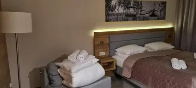 Łóżko lub łóżka w pokoju w obiekcie Aparthotel Apartamenty Czarna Góra 131