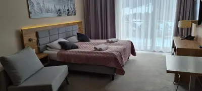 Łóżko lub łóżka w pokoju w obiekcie Aparthotel Apartamenty Czarna Góra 131