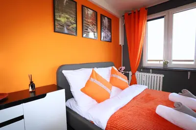 Łóżko lub łóżka w pokoju w obiekcie Apartament Książęca Góra