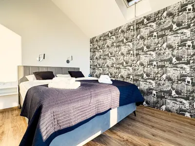 Łóżko lub łóżka w pokoju w obiekcie Loft Śnieżnik