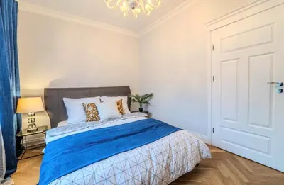 Łóżko lub łóżka w pokoju w obiekcie Big Apartment Wroclaw - Center - 4 Rooms - 6 Beds - 2 Balcony - 12 people - 100m2