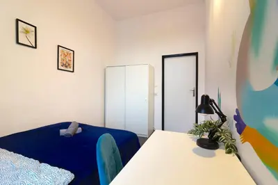 Łóżko lub łóżka w pokoju w obiekcie Sienkiewicza City Art