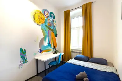 Łóżko lub łóżka w pokoju w obiekcie Sienkiewicza City Art