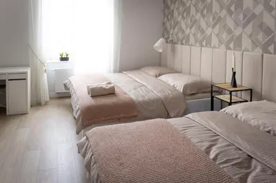 Łóżko lub łóżka w pokoju w obiekcie Magnolia 1
