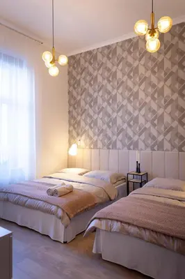 Łóżko lub łóżka w pokoju w obiekcie Magnolia 1