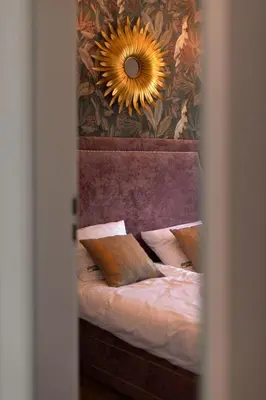 Łóżko lub łóżka w pokoju w obiekcie Apartament Kardamon - Sudeckie Historie