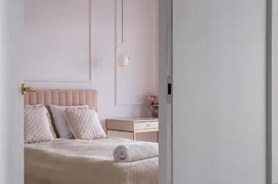 Łóżko lub łóżka w pokoju w obiekcie RentPlanet - Apartamenty Quorum