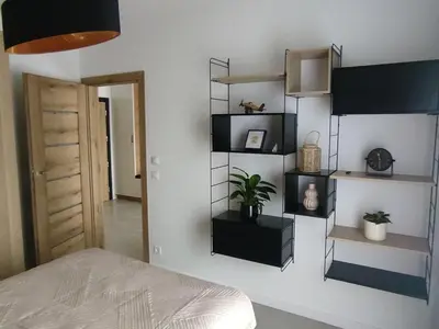 Łóżko lub łóżka w pokoju w obiekcie Czarno biały
