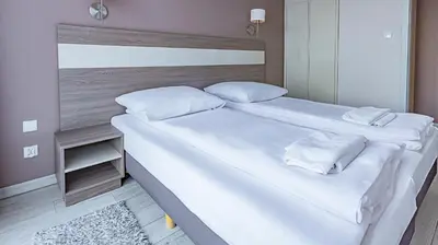 Łóżko lub łóżka w pokoju w obiekcie VacationClub - Tignes Apartament 22