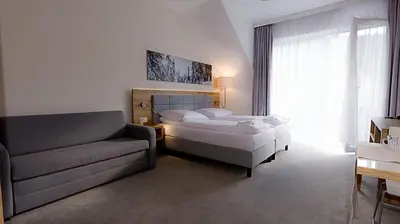 Łóżko lub łóżka w pokoju w obiekcie VacationClub - Aparthotel Czarna Góra Apartament 323
