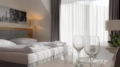 Łóżko lub łóżka w pokoju w obiekcie VacationClub - Aparthotel Czarna Góra Apartament 323
