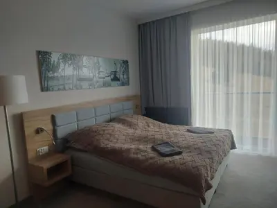 Łóżko lub łóżka w pokoju w obiekcie Aparthotel Panorama-Czarna Góra Resort