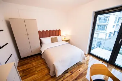 Łóżko lub łóżka w pokoju w obiekcie Luksusowy Apartament Przy Parku