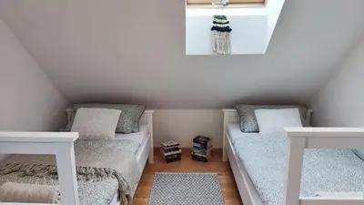Łóżko lub łóżka w pokoju w obiekcie Dom z bala sauna jacuzzi Saunowisko