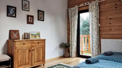 Łóżko lub łóżka w pokoju w obiekcie Dom z bala sauna jacuzzi Saunowisko