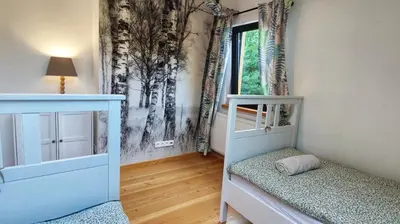 Łóżko lub łóżka w pokoju w obiekcie Dom z bala sauna jacuzzi Saunowisko