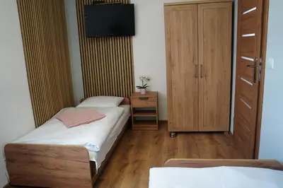 Łóżko lub łóżka w pokoju w obiekcie Agroturystyka Marianówek