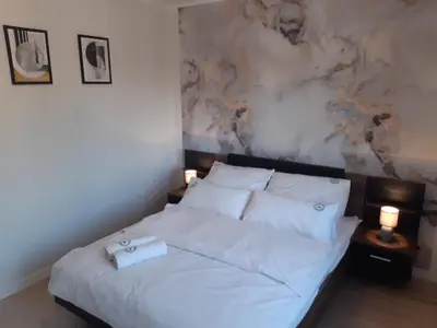 Łóżko lub łóżka w pokoju w obiekcie Apartament w Czarnowąsach 1