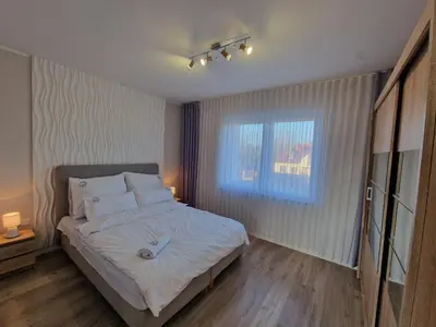 Łóżko lub łóżka w pokoju w obiekcie Apartament w Czarnowąsach 2
