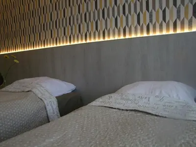 Łóżko lub łóżka w pokoju w obiekcie U Henriety