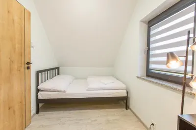 Łóżko lub łóżka w pokoju w obiekcie SUDECKA K0RONA domki całoroczne
