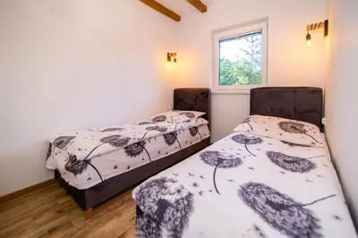 Łóżko lub łóżka w pokoju w obiekcie Apartament Marta