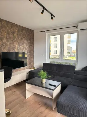 Część wypoczynkowa w obiekcie Stylowy apartament z ogródkiem i tarasem