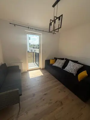 Część wypoczynkowa w obiekcie Stylowy apartament z ogródkiem i tarasem